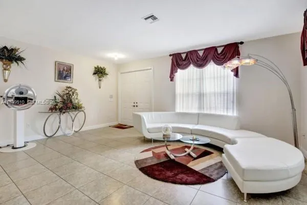 a living room with furniture and a couch