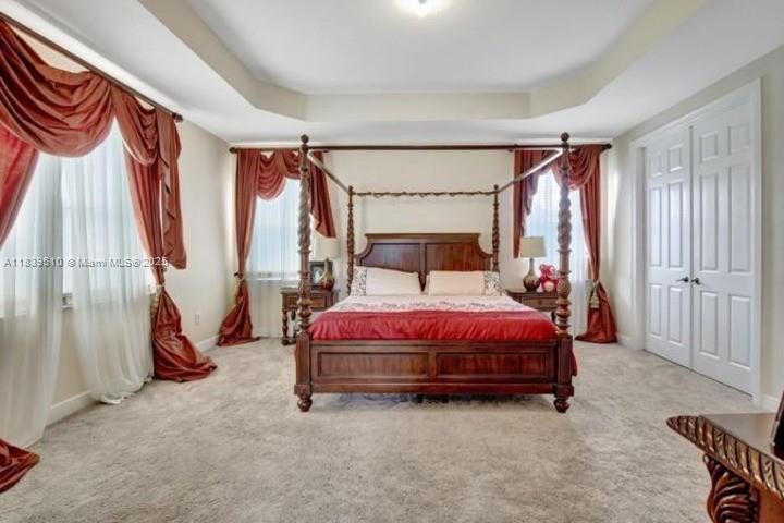 5078 Southwest 183rd Avenue Miramar, FL 33029 - Photo 6 of 15 a bed sitting in a room next to a window