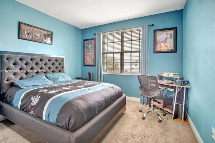 5078 Southwest 183rd Avenue Miramar, FL 33029 - Photo 10 of 15 a bedroom with bed and a window