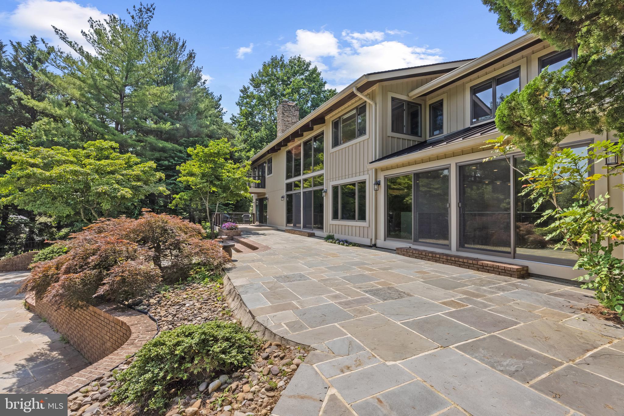 917 Childs Point Road Annapolis, MD 21401 - Photo 33 of 40 Expansive back patio leading down to the pool