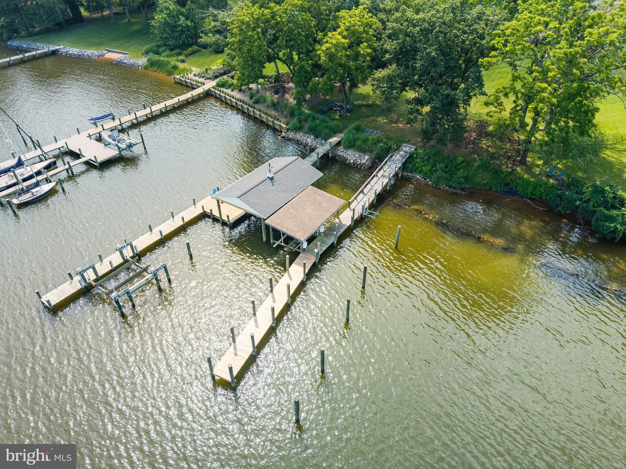 917 Childs Point Road Annapolis, MD 21401 - Photo 5 of 40 Pier w/ multiple slips, lifts & coveted boathouse