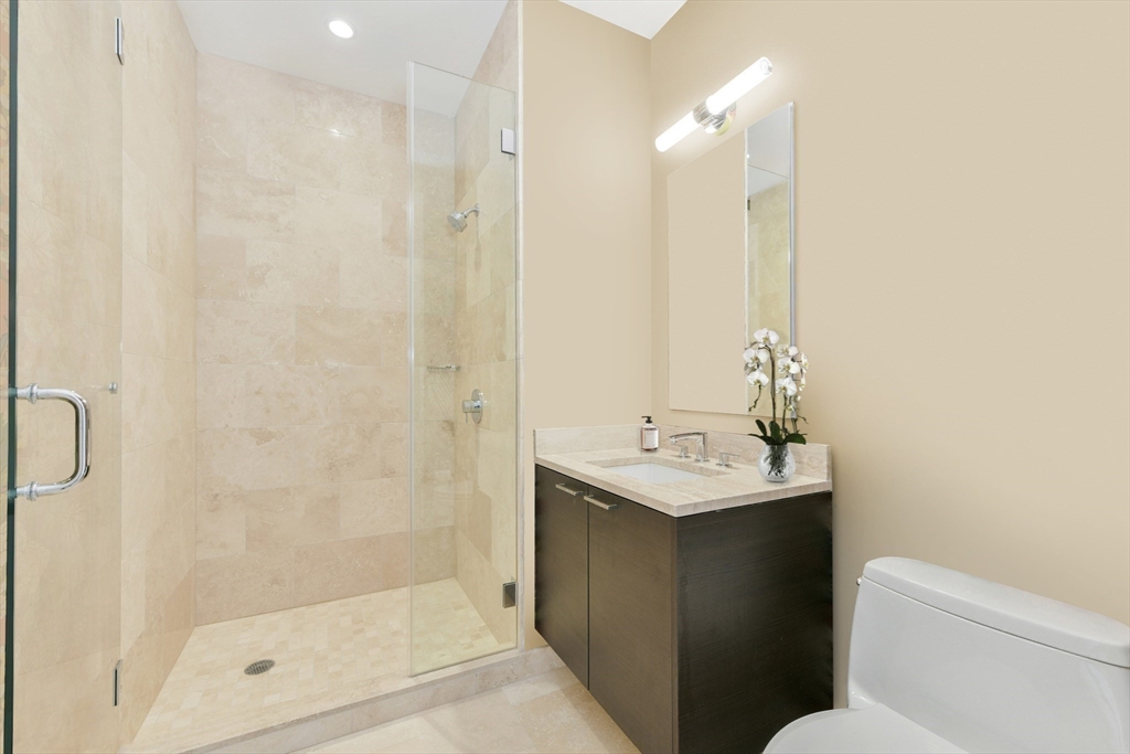 1 Franklin Street, Unit 4204 Boston, MA 02110 - Photo 11 of 37 a bathroom with a sink toilet and shower