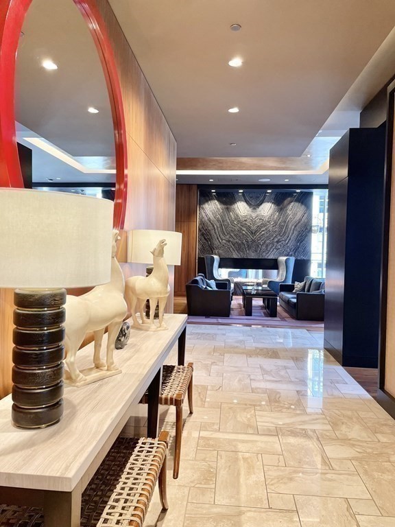 1 Franklin Street, Unit 4204 Boston, MA 02110 - Photo 16 of 37 a living room with furniture and a flat screen tv