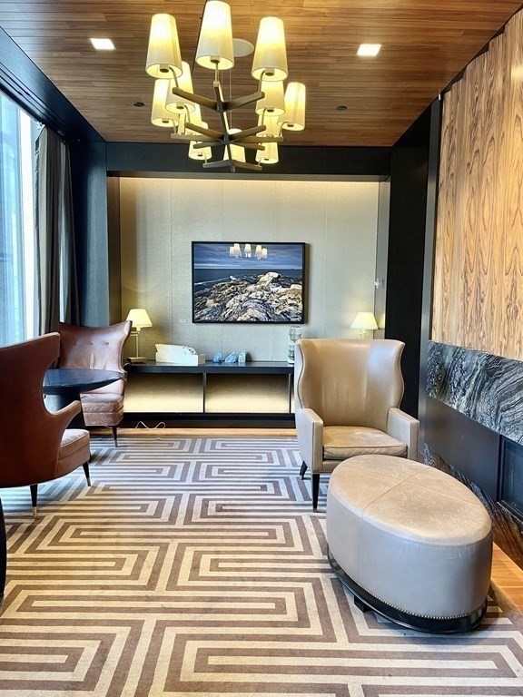 1 Franklin Street, Unit 4204 Boston, MA 02110 - Photo 18 of 37 a living room with furniture and a rug