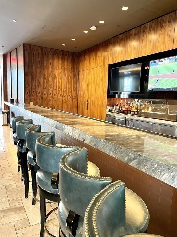 1 Franklin Street, Unit 4204 Boston, MA 02110 - Photo 20 of 37 a kitchen with dining table and chairs