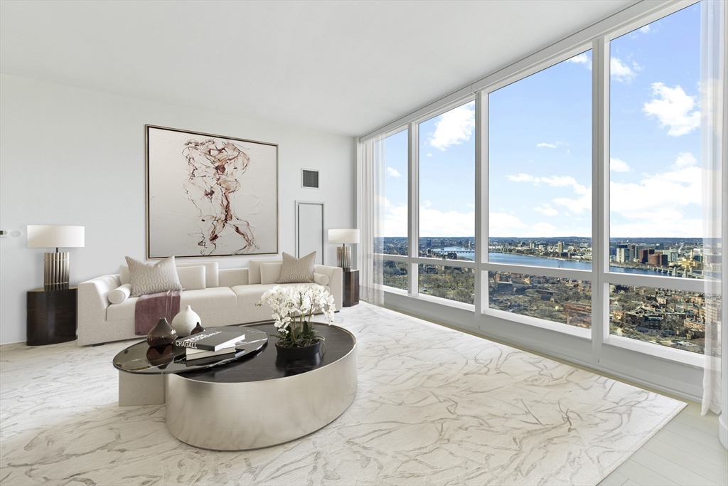1 Franklin Street, Unit 4204 Boston, MA 02110 - Photo 2 of 37 a living room with furniture and a large window