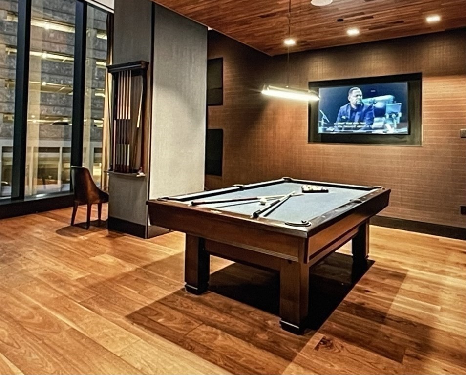 1 Franklin Street, Unit 4204 Boston, MA 02110 - Photo 24 of 37 a room with pool table and windows