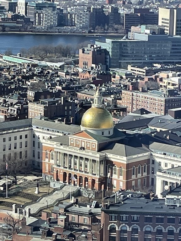 1 Franklin Street, Unit 4204 Boston, MA 02110 - Photo 33 of 37 a large building with a lot of cars parked