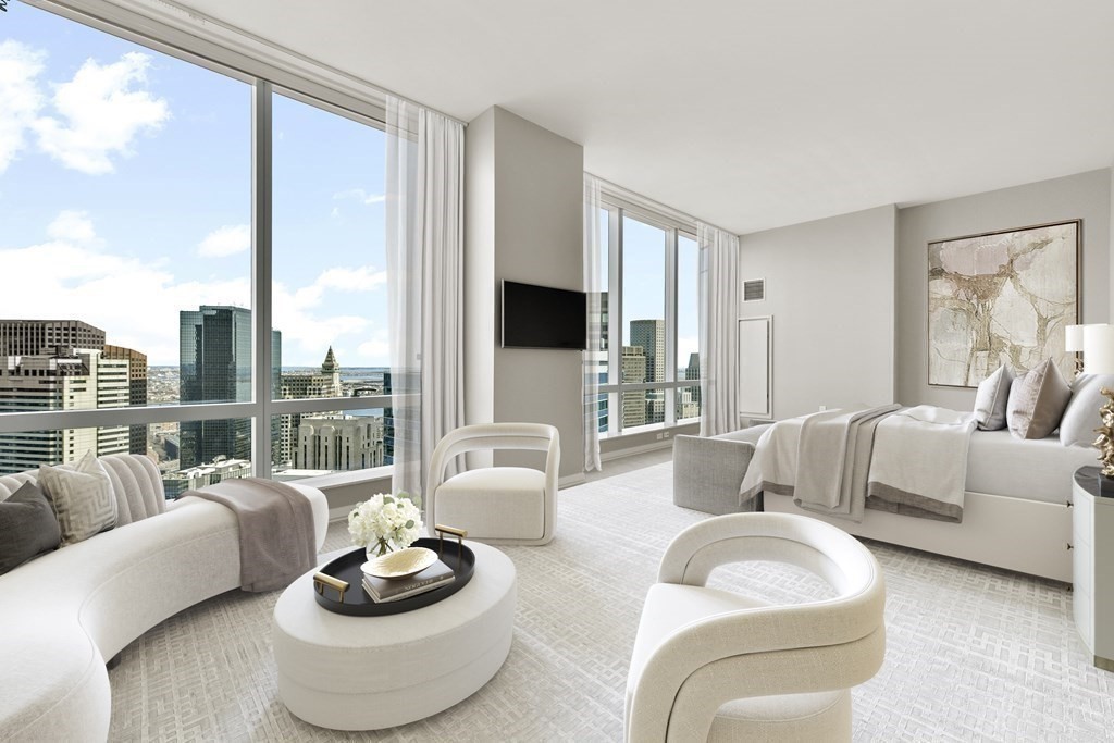 1 Franklin Street, Unit 4204 Boston, MA 02110 - Photo 6 of 37 a living room with furniture and a large window