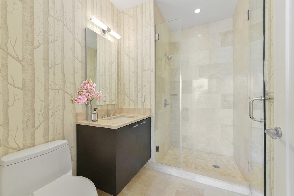 1 Franklin Street, Unit 4204 Boston, MA 02110 - Photo 9 of 37 a bathroom with a sink toilet and shower