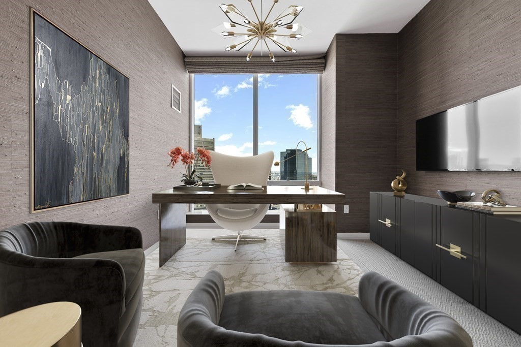 1 Franklin Street, Unit 4204 Boston, MA 02110 - Photo 10 of 37 a living room with furniture and a fireplace