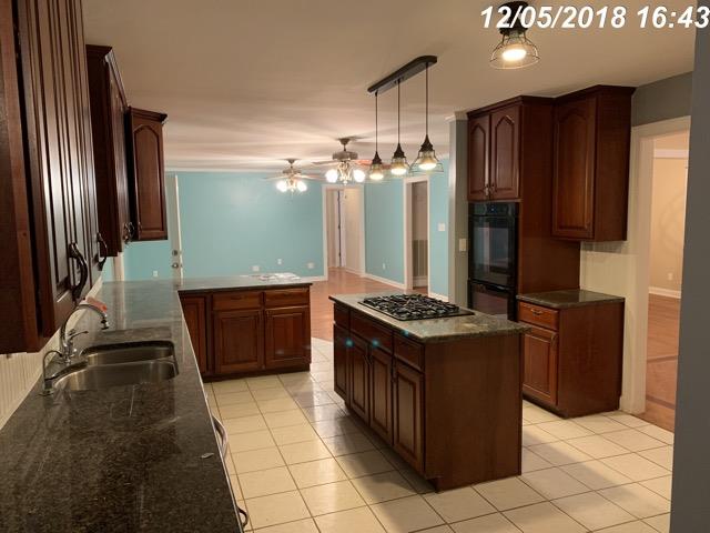 2770 Cooks Road Mount Juliet, TN 37122 - Photo 2 of 16 a kitchen with stainless steel appliances granite countertop a stove a sink and a refrigerator
