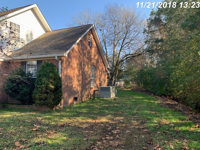 2770 Cooks Road Mount Juliet, TN 37122 - Photo 15 of 16 a backyard of a house with plants and large trees