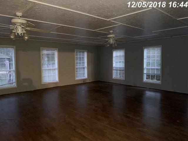 2770 Cooks Road Mount Juliet, TN 37122 - Photo 5 of 16 a view of an empty room with wooden floor and a window