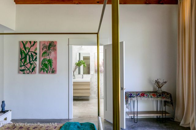 a bathroom with a sink a mirror and a shower