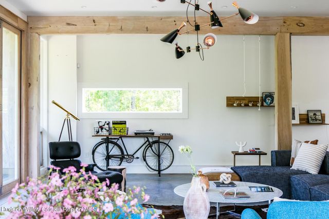 a view of a chair and tables in the patio