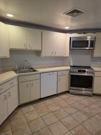 a kitchen with a stove and a sink