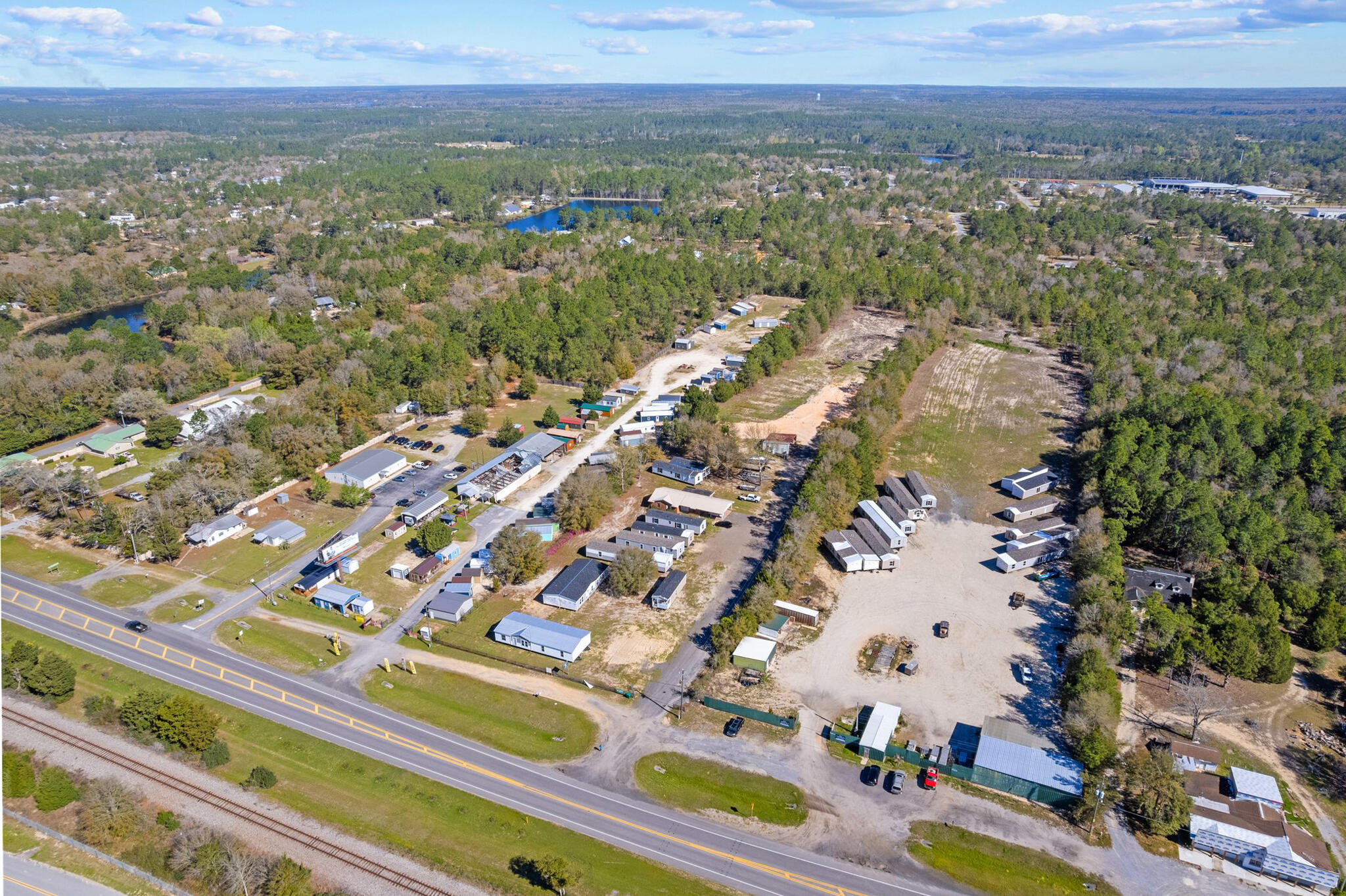 2270 US 90 DeFuniak Springs, FL 32433 - Photo 9 of 14 an aerial view of residential houses with outdoor space