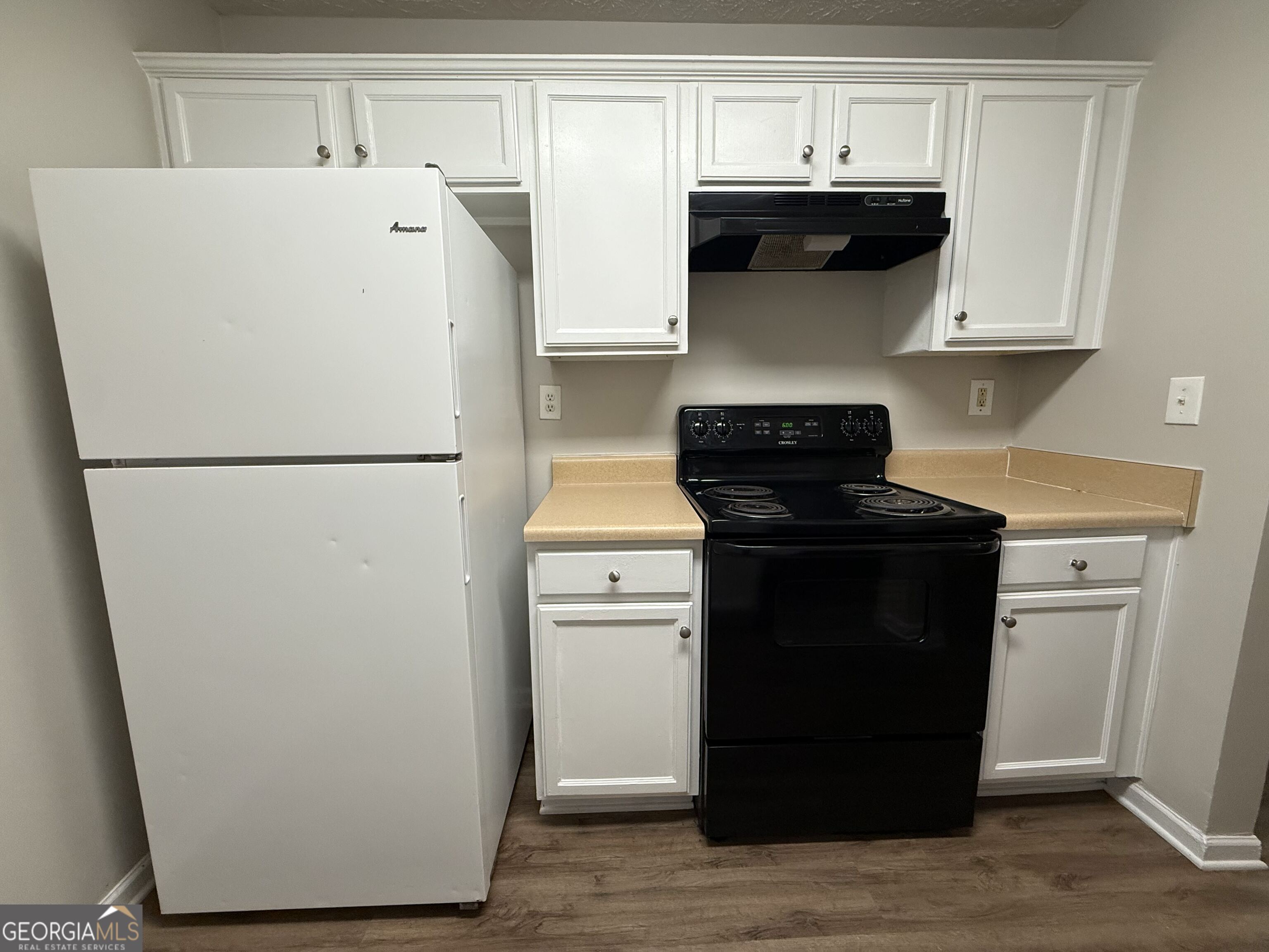 6132 Ruth Street Southwest Covington, GA 30014 - Photo 12 of 33 a white refrigerator freezer sitting inside of a kitchen