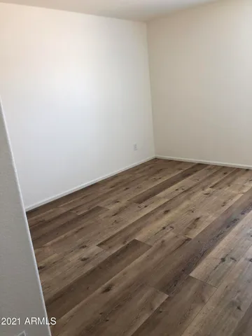 a view of staircase with railing and a window