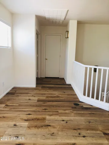a view of entryway with wooden floor