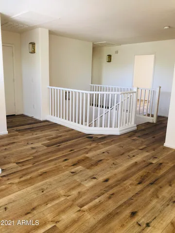 a view of walk in closet and bedroom