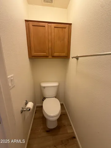 a bathroom with a double vanity sink a mirror and a bathtub