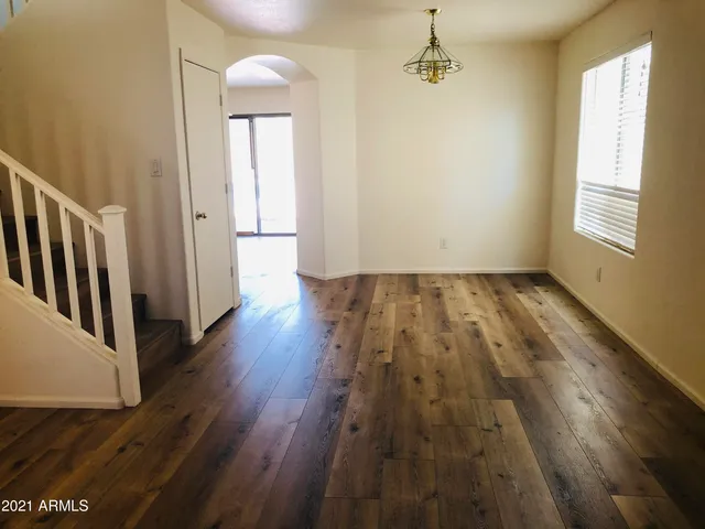 a view of an empty room with a fireplace