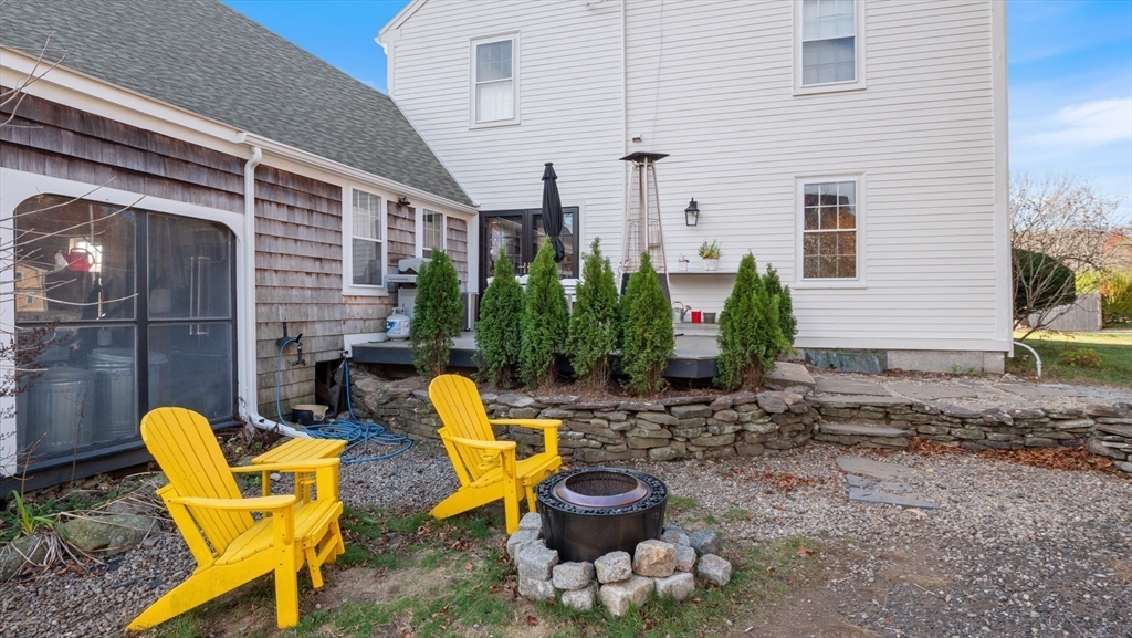 239 High Road Newbury, MA 01951 - Photo 3 of 42 a view of a chair with fire pit in patio