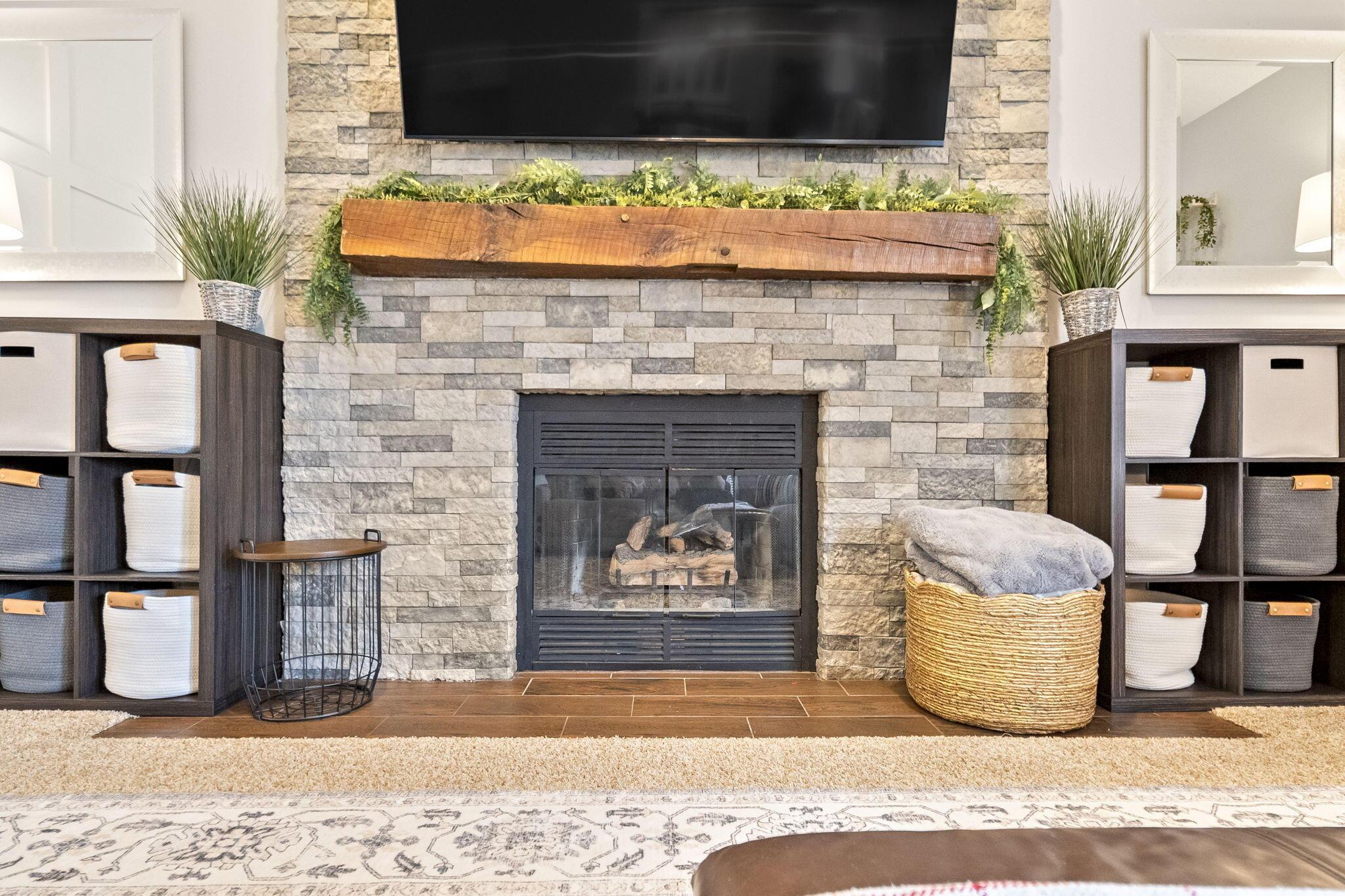 107 Ravine Road Powell, OH 43065 - Photo 19 of 52 Converted to gas, new stone surround, and beam board mantel