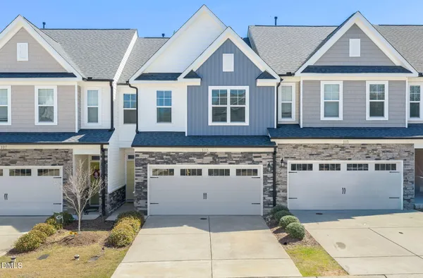 a view of a white house with a large windows