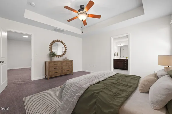 a bathroom with a double vanity sink mirror and bathtub