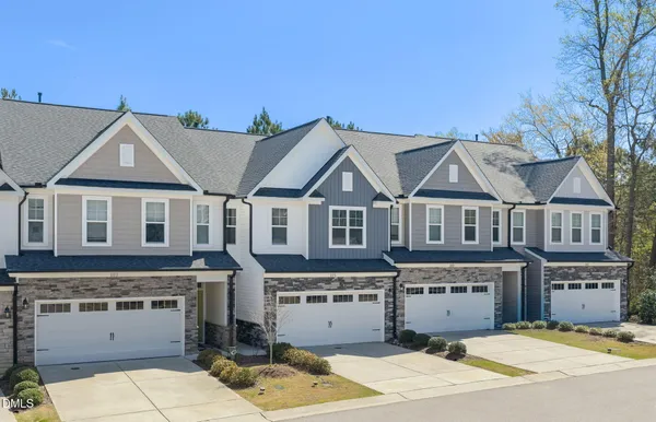 an aerial view of a house with swimming pool and outdoor space