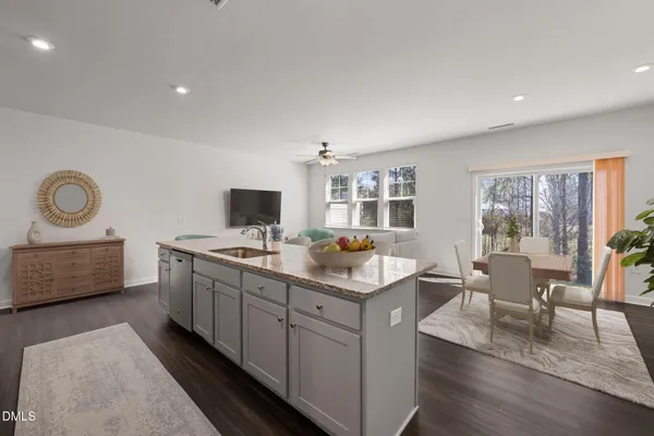 a kitchen with a sink and a stove top oven