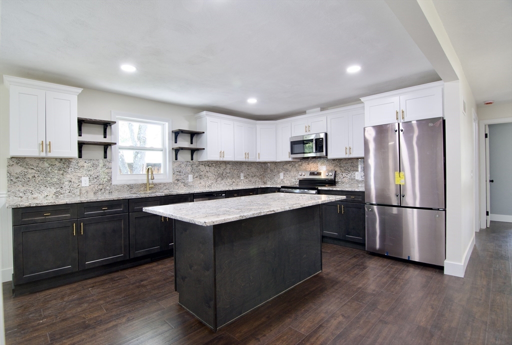 12 Dwight Street Hatfield, MA 01038 - Photo 14 of 42 a kitchen with a refrigerator a microwave a sink and cabinets