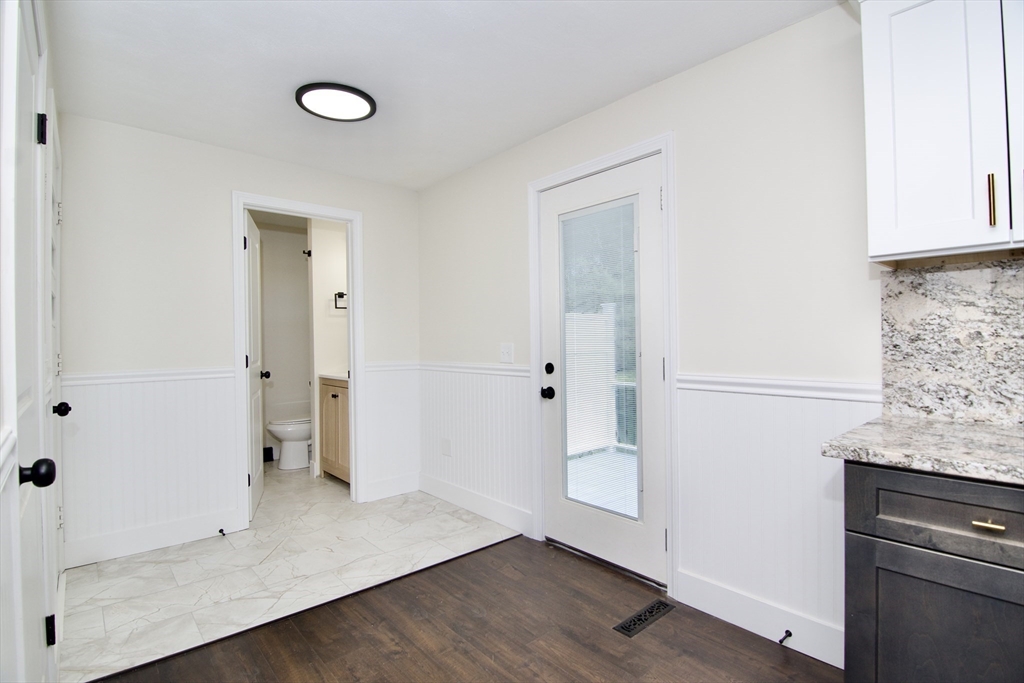 12 Dwight Street Hatfield, MA 01038 - Photo 18 of 42 an empty room with wooden floor and cabinet