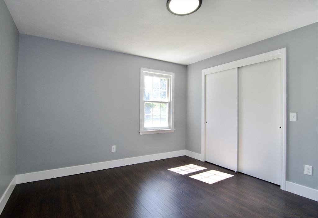 12 Dwight Street Hatfield, MA 01038 - Photo 20 of 42 a view of an empty room with wooden floor and a window