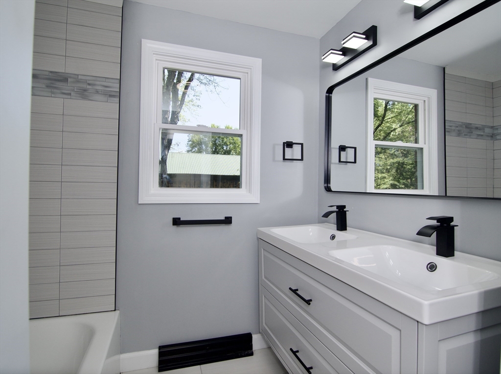 12 Dwight Street Hatfield, MA 01038 - Photo 24 of 42 a bathroom with a sink window and a bathtub