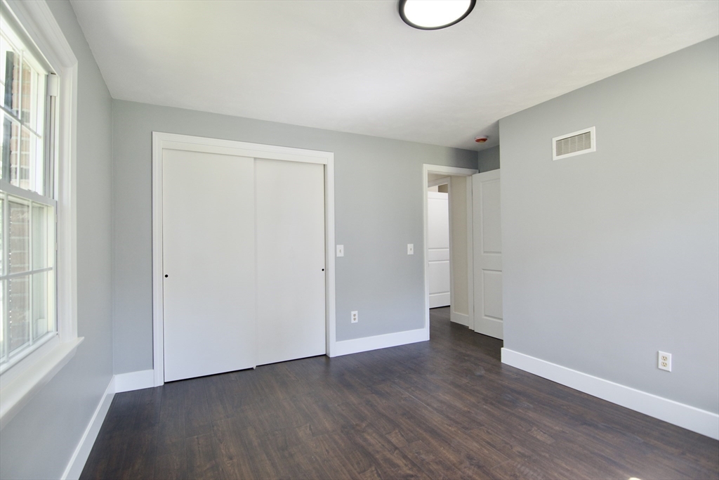 12 Dwight Street Hatfield, MA 01038 - Photo 28 of 42 an empty room with wooden floor and windows
