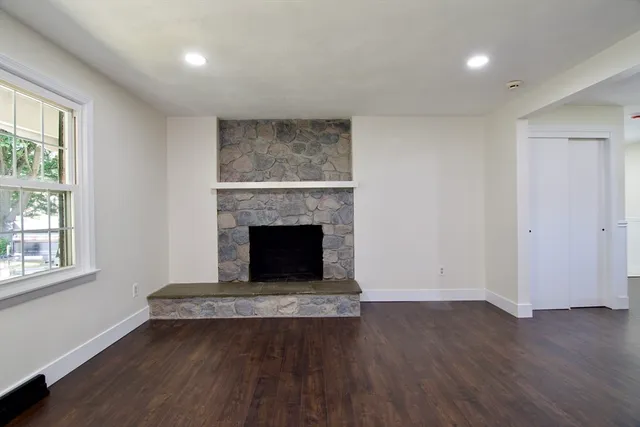 a kitchen with kitchen island granite countertop a sink and stove top oven