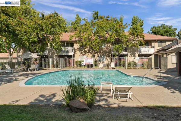 a view of a backyard with sitting area
