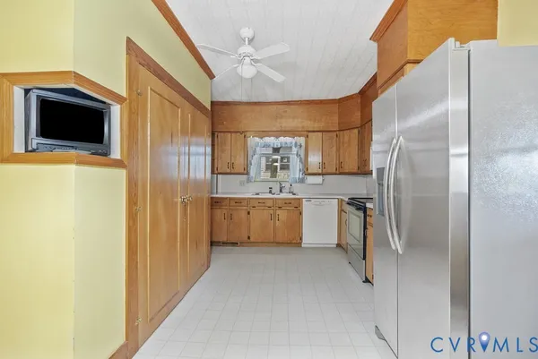 a kitchen with white cabinets and a sink