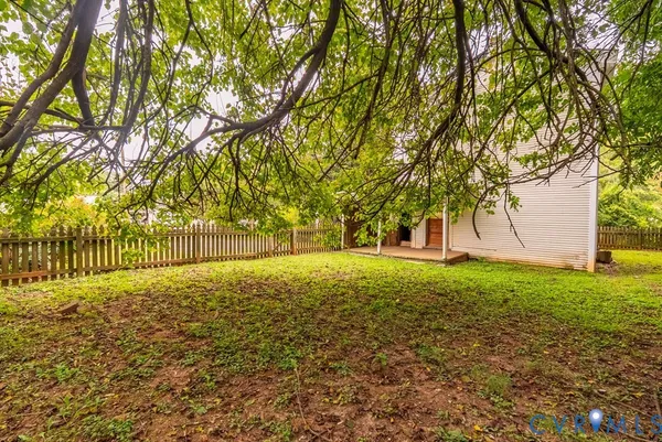 a swimming pool with trees in the background