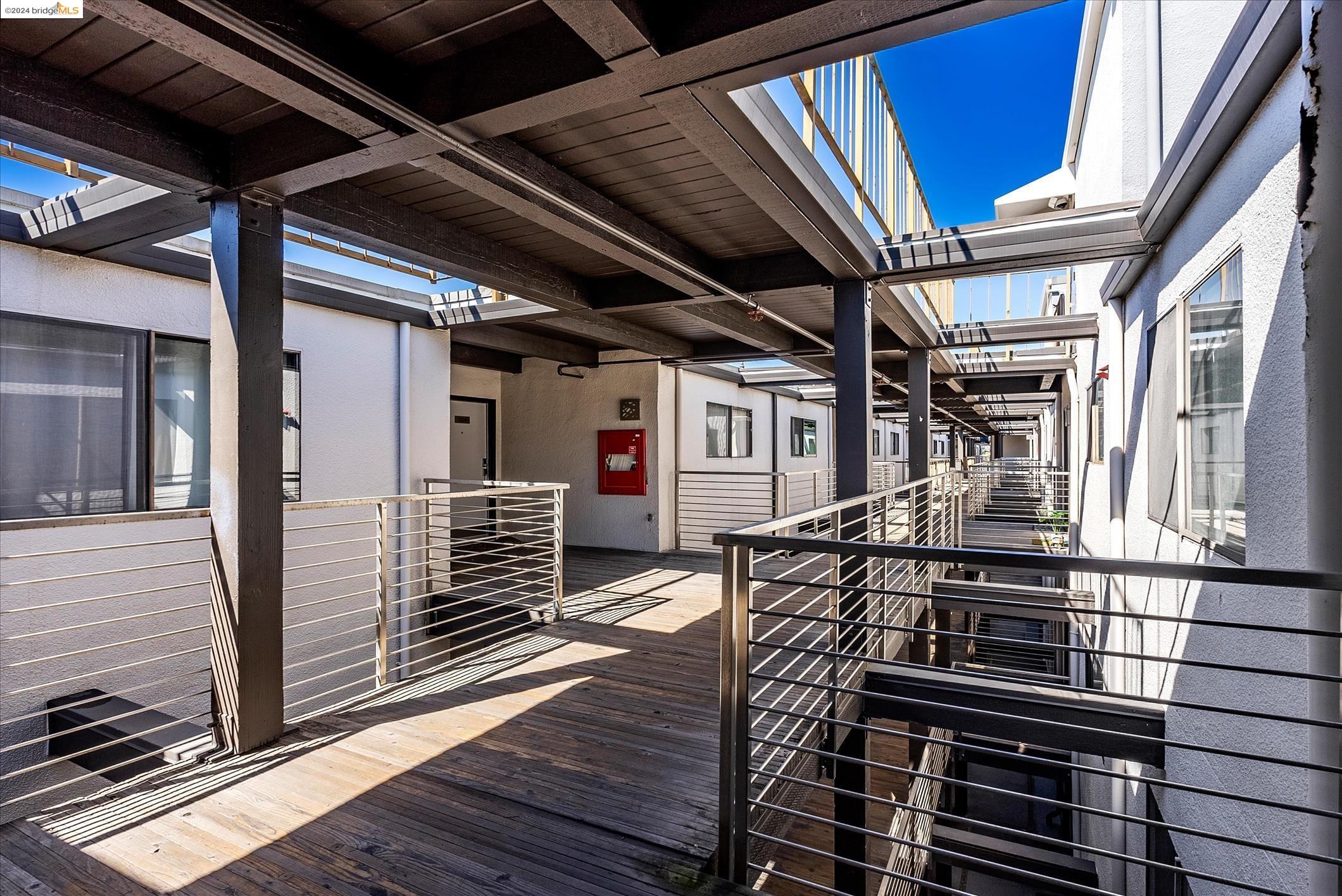 a view of a balcony with wooden floor