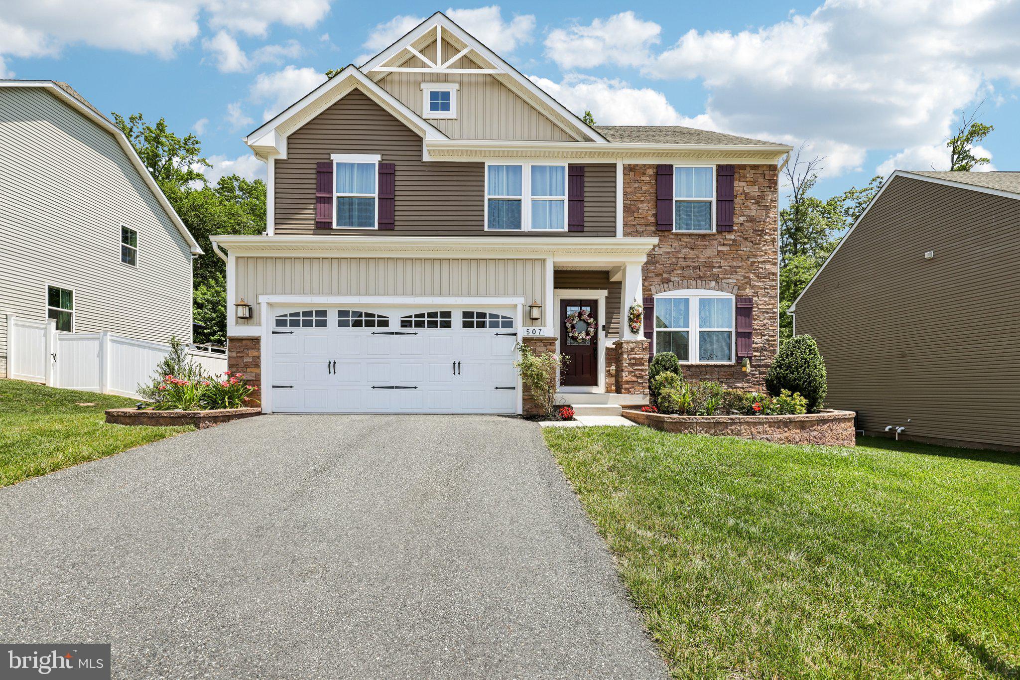 507 Potomac Road Joppa, MD 21085 - Photo 6 of 66 a front view of a house with a yard and garage