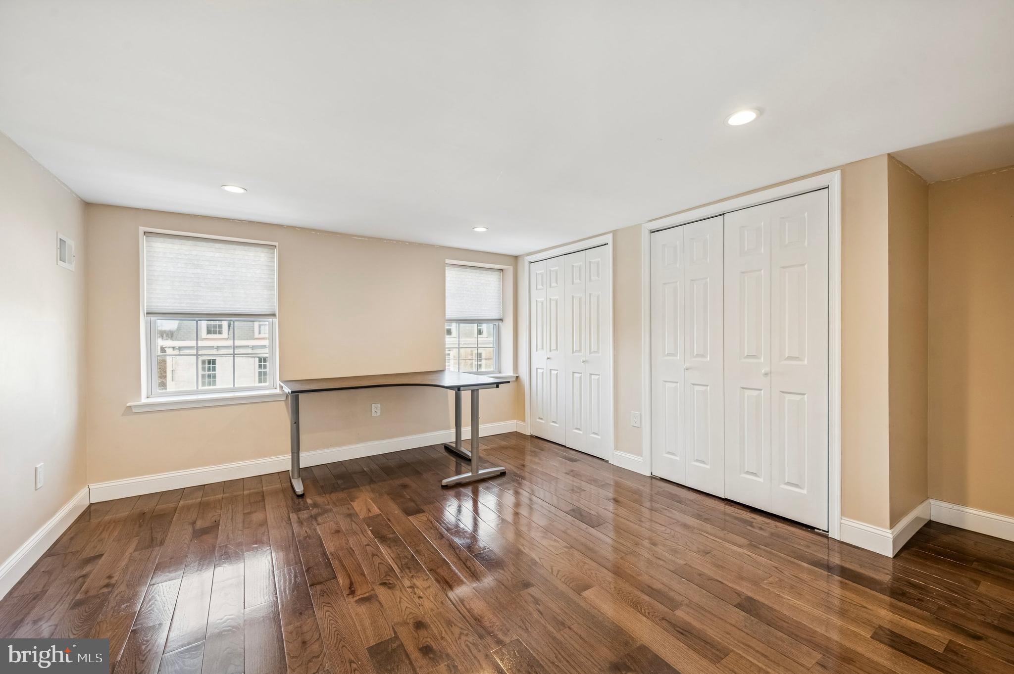 3730 Spring Garden Street Philadelphia, PA 19104 - Photo 13 of 24 an empty room with wooden floor cabinet and windows