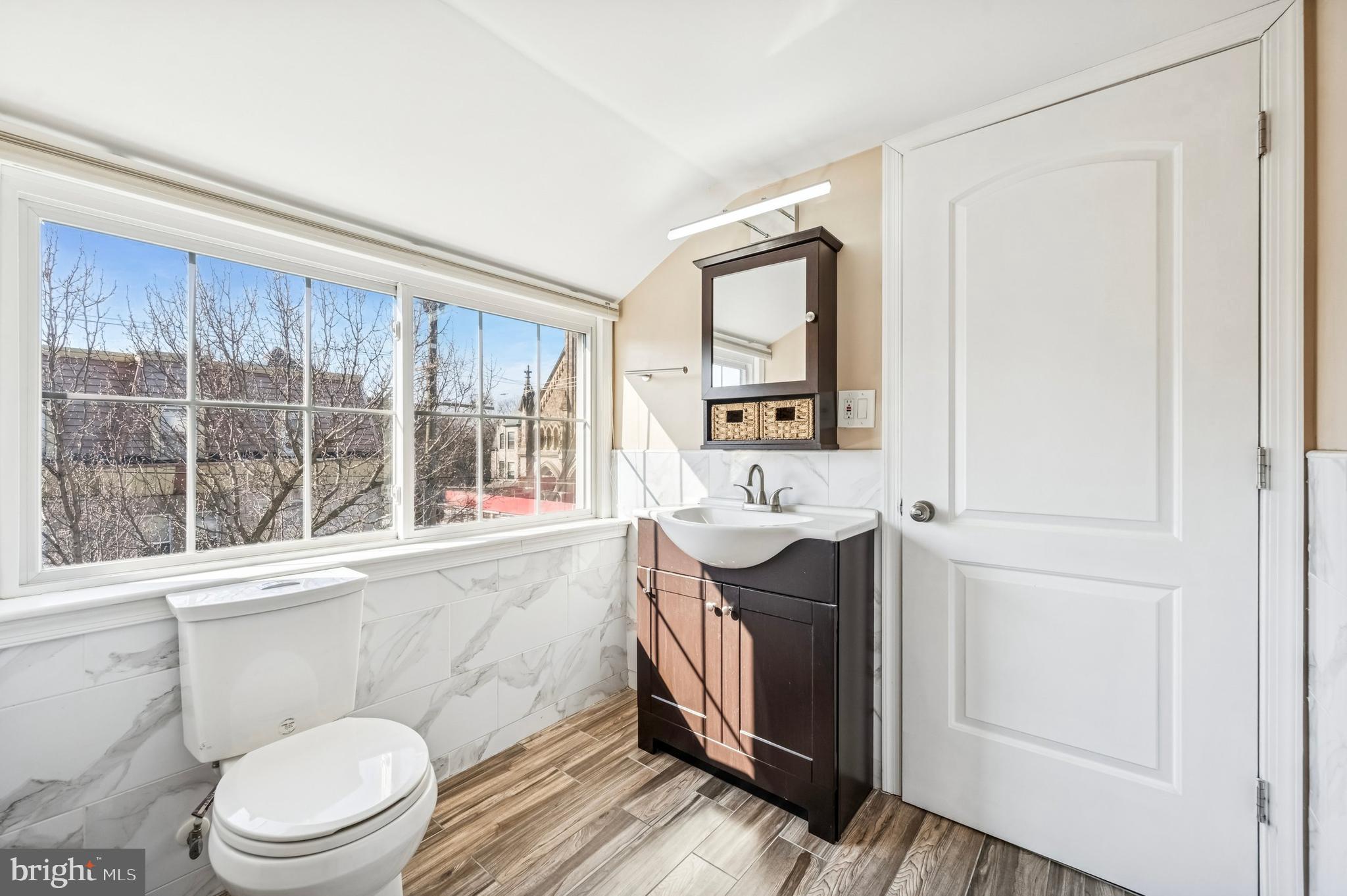 3730 Spring Garden Street Philadelphia, PA 19104 - Photo 18 of 24 a bathroom with a sink toilet and window