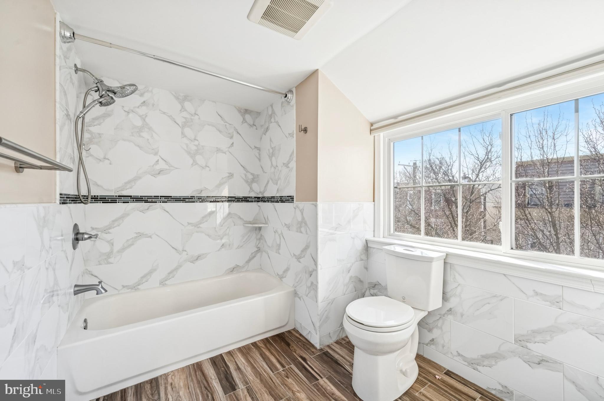 3730 Spring Garden Street Philadelphia, PA 19104 - Photo 19 of 24 a bathroom with a toilet and a bathtub