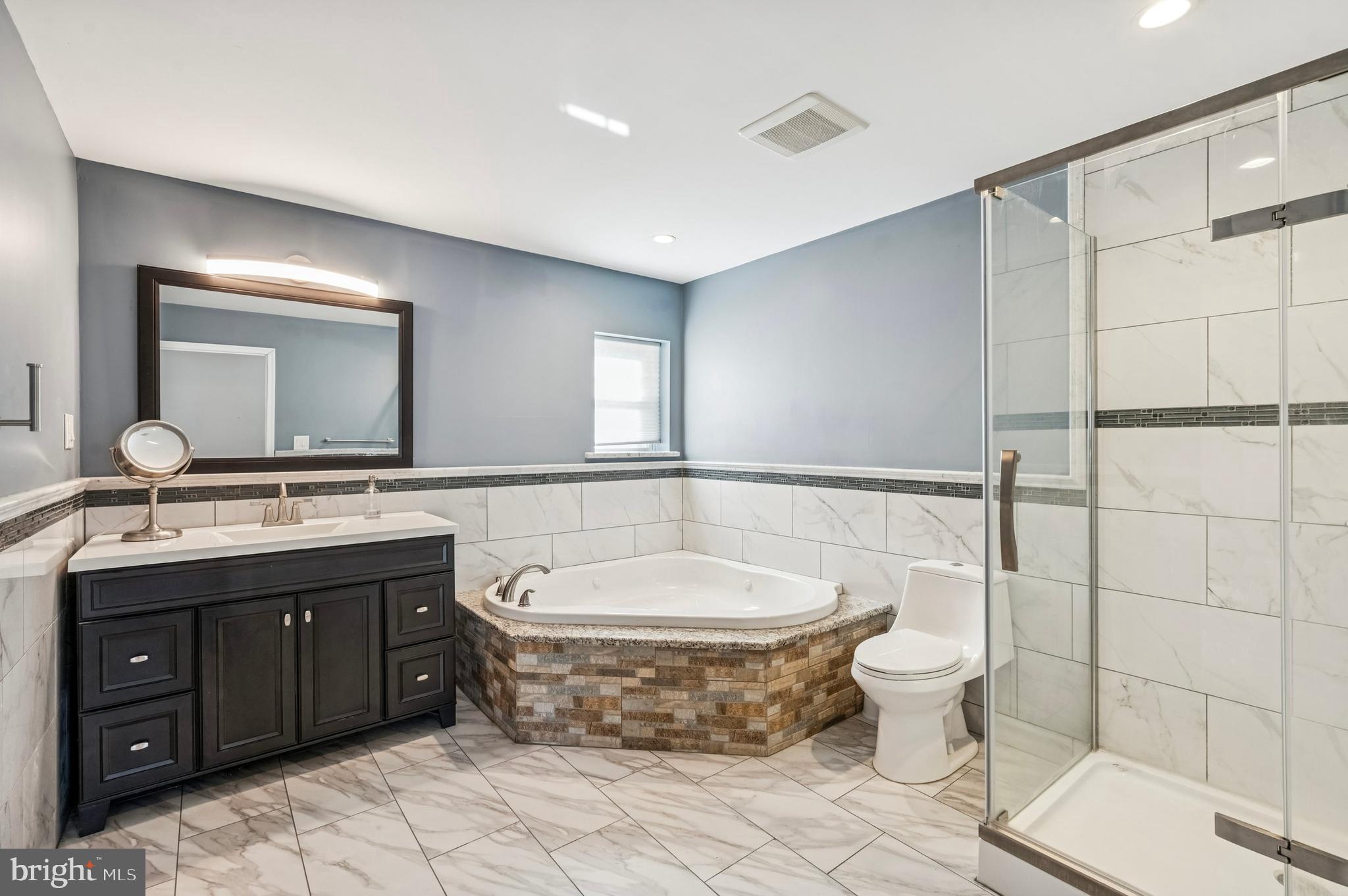 3730 Spring Garden Street Philadelphia, PA 19104 - Photo 20 of 24 a spacious bathroom with a toilet sink and mirror
