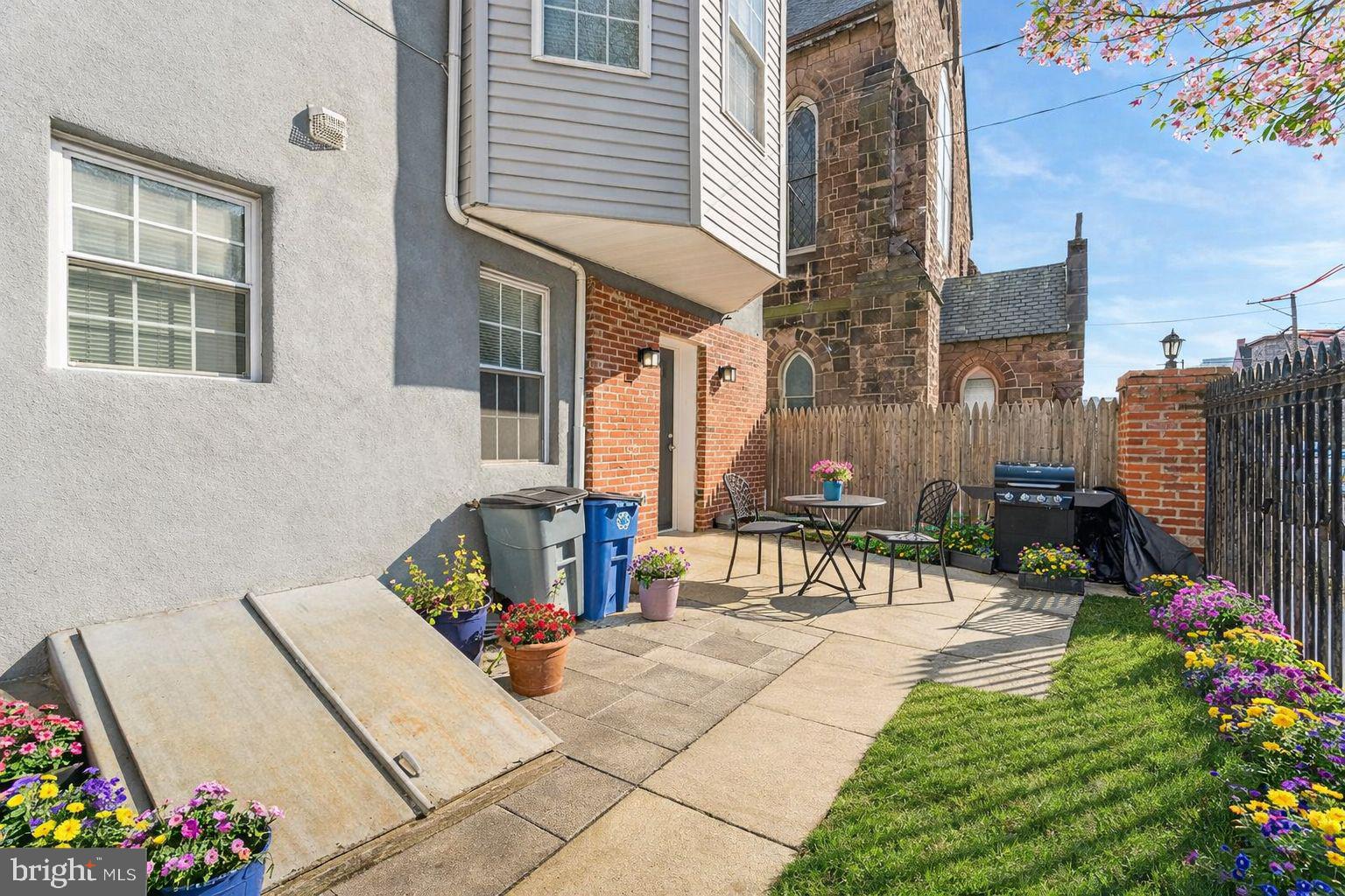 3730 Spring Garden Street Philadelphia, PA 19104 - Photo 22 of 24 a view of a patio with table and chairs and potted plants